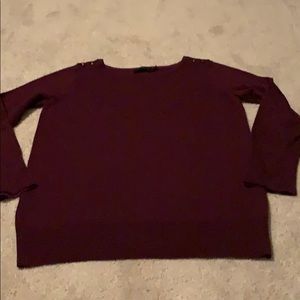 Burgundy long sleeve sweater.